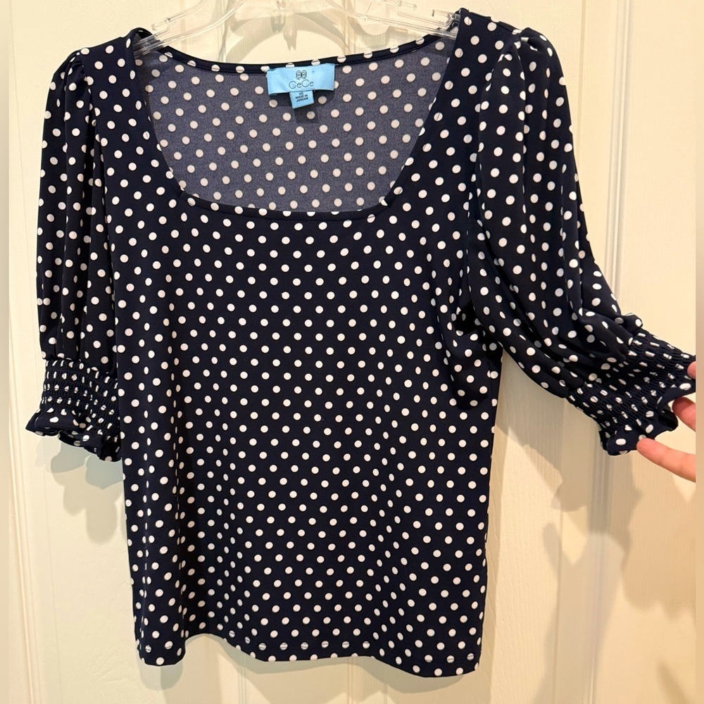 CeCe blue and white polkadot top. Size XS.